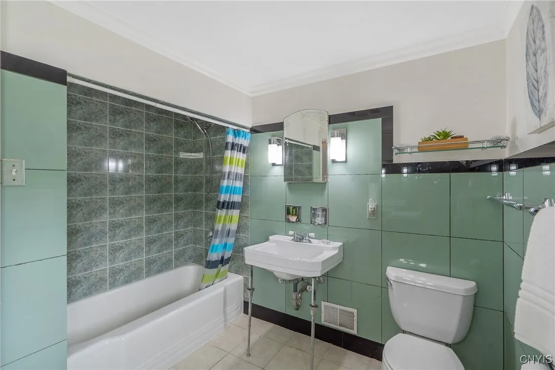 And note the tub/shower with easy-to-clean surround at the walls. This concludes our tour of the bedroom level.