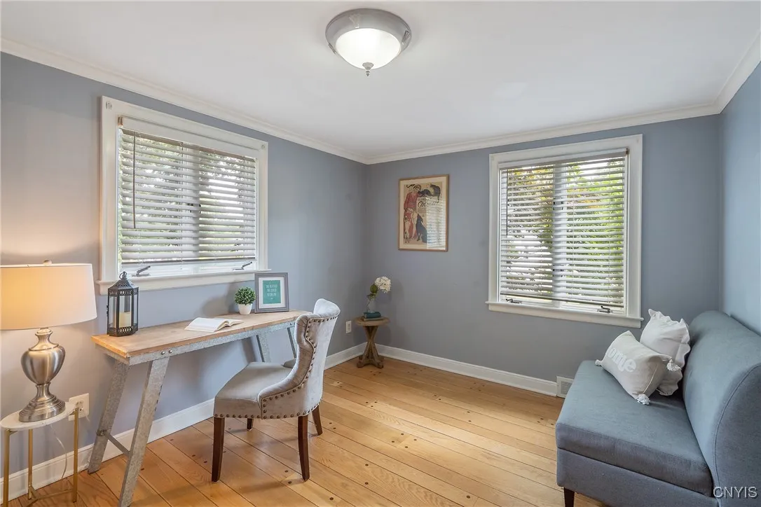 This good-sized room sits in the front corner of the home with spectacular natural light pouring in through the windows. Plenty of space for a bed and dressers here if the bedroom purpose is utilized.