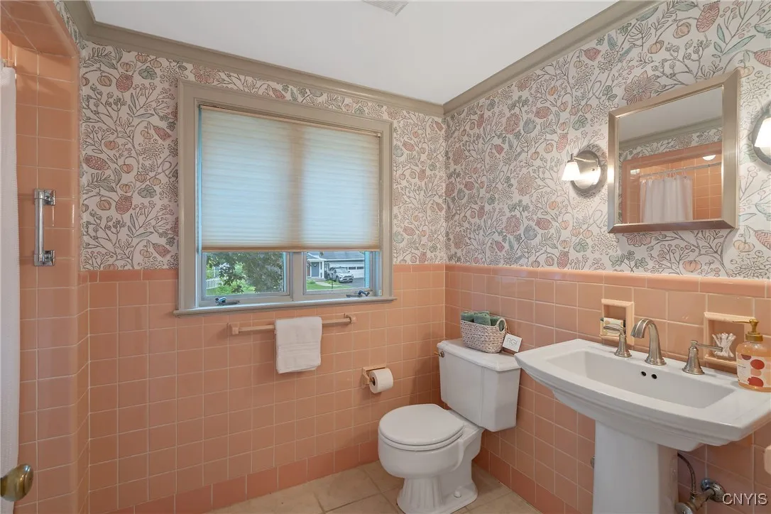 And the serene hues of the primary bath combined with tasteful fixtures create a winsome space for daily ablutions.