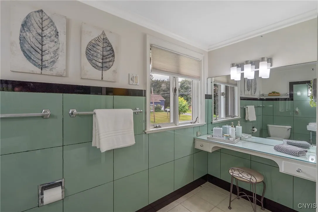 Let's not forget the 2nd full bath of this level situated next to the bedroom we just toured. It is ample in space with another built-in vanity - how valuable!