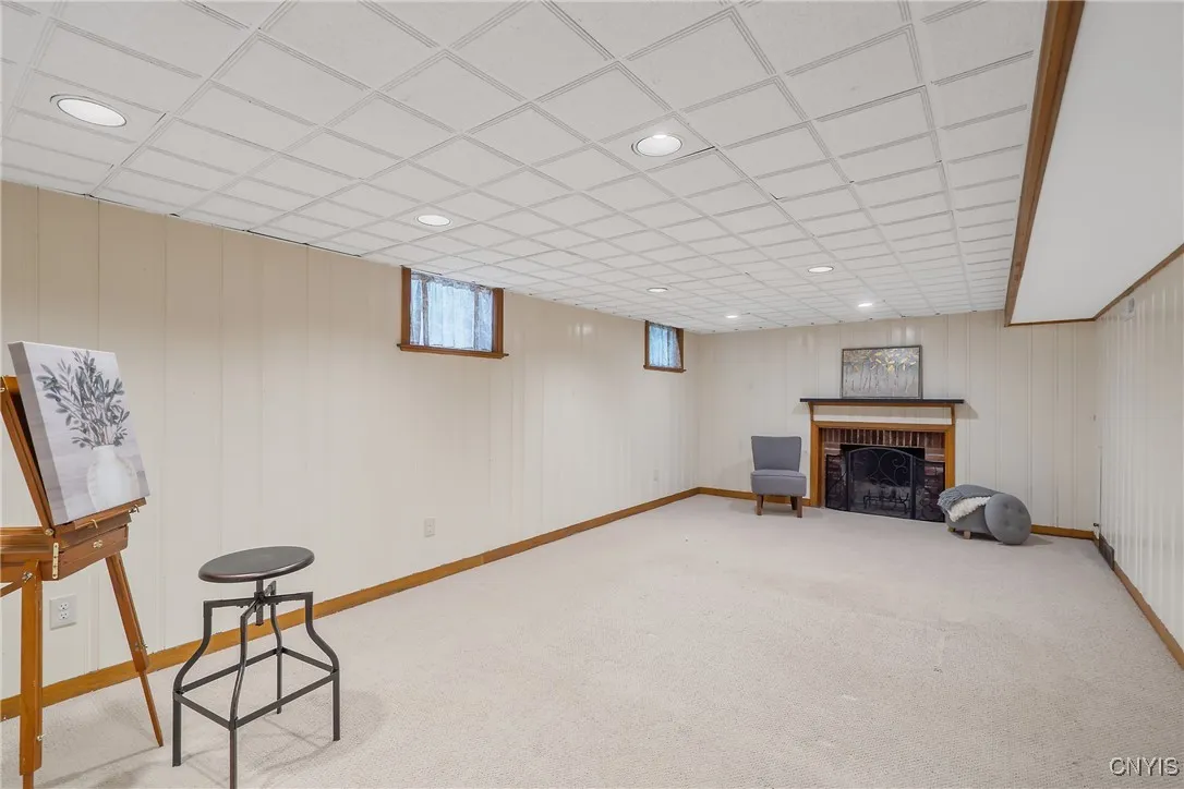 And last but not least, we see the marvelous & bright finished basement here with a 2nd woodburning fireplace for those chilly winter nights!
