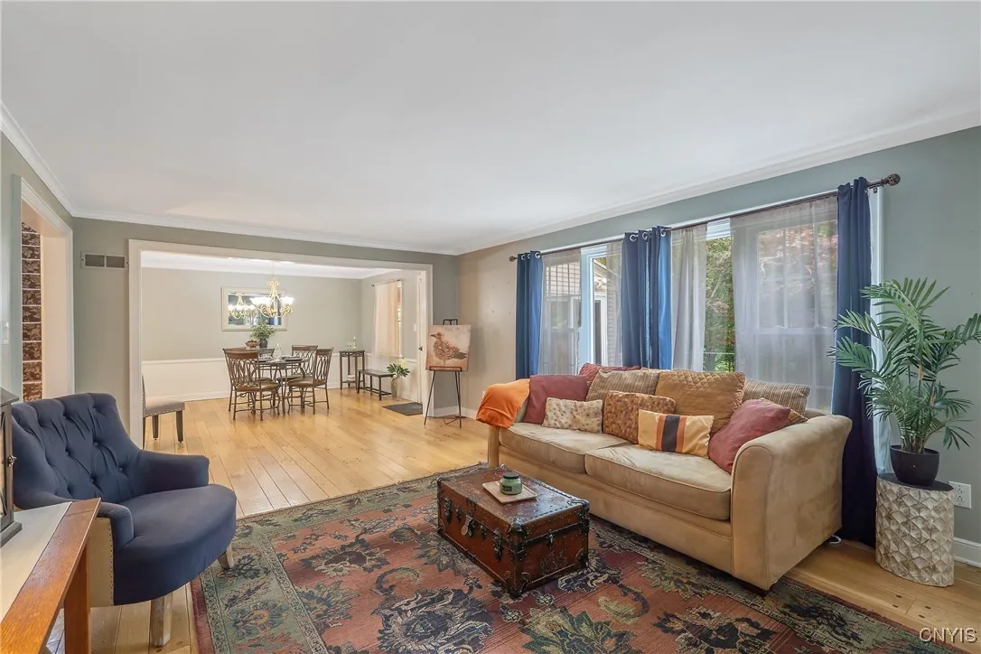 And from this perspective, we see how the room extends across the back wall of the home to the dining room.