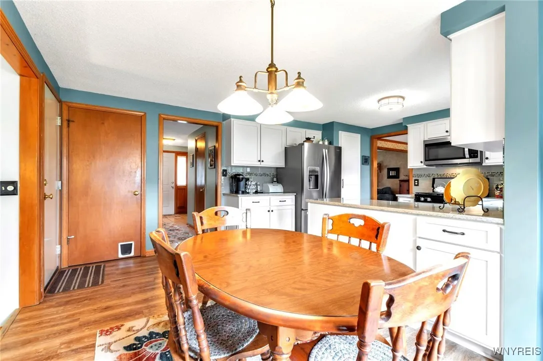Kitchen dining area w/pretty brass chandelier