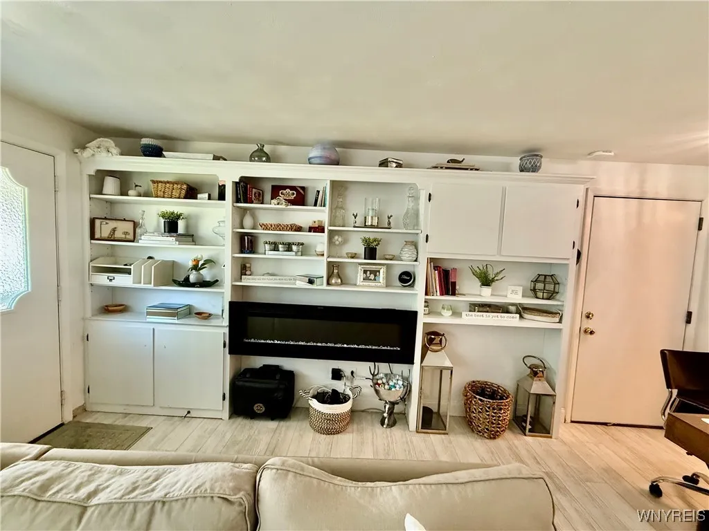 Attached Wall Unit with modern Fire Place Built in Shelves for the book Collector