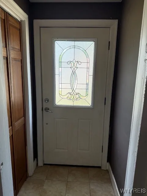 Insulated front foyer door and coat closet