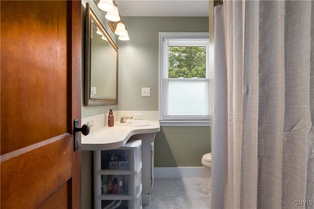 Full bath with new flooring and fresh paint