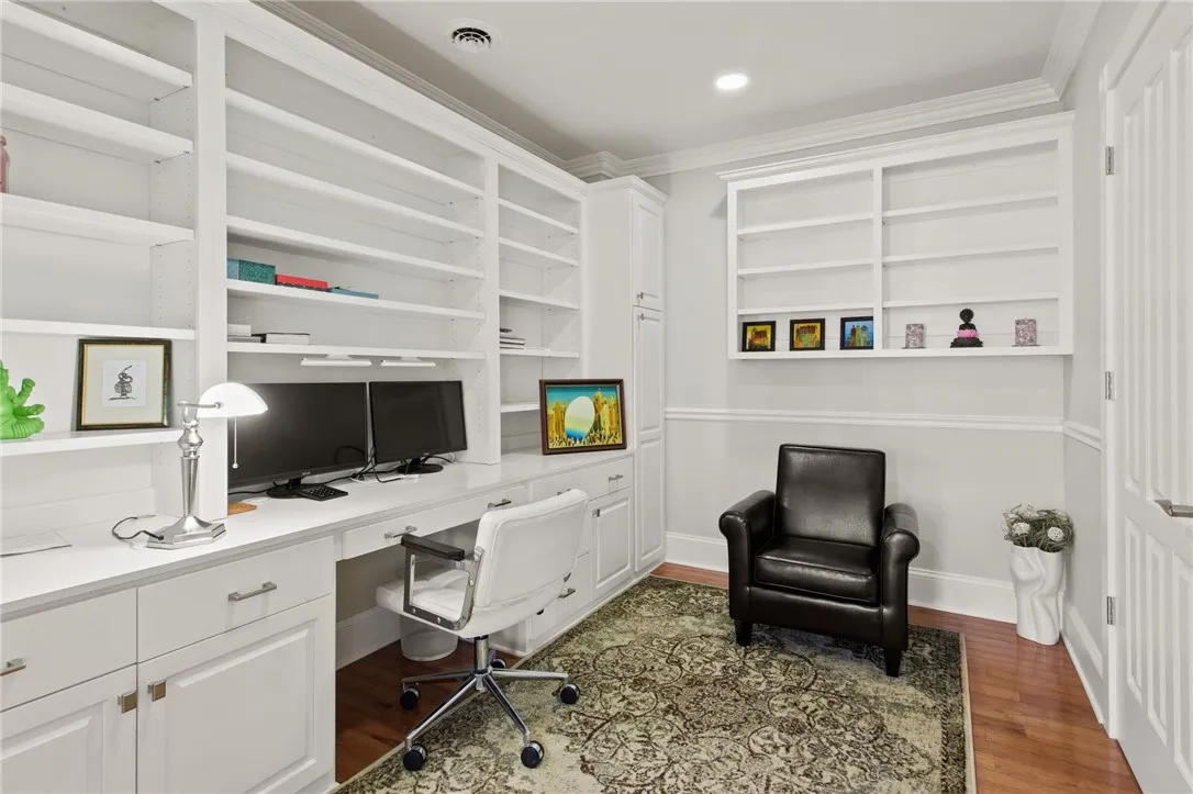 A quiet, dedicated workspace designed for focus and function—plus convenient access to a half bath just steps away.