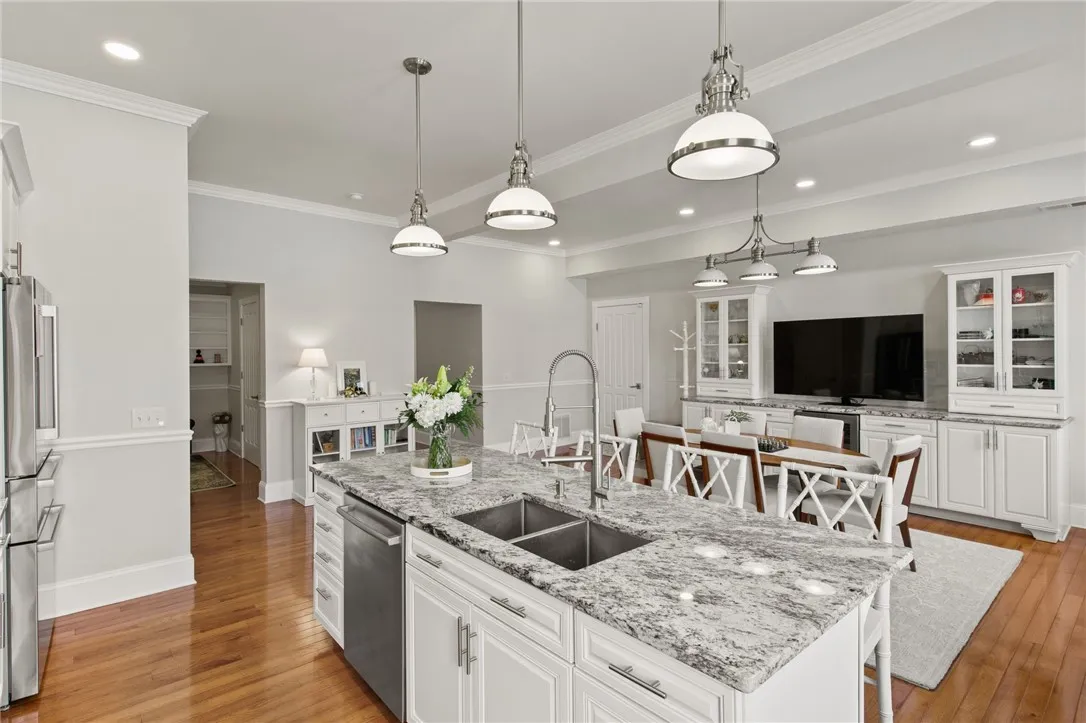 Kitchen with nearby home office and bath