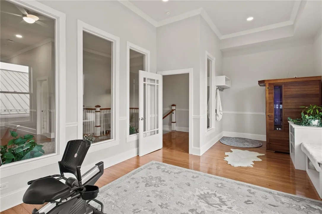 Fitness Room – Interior windows bring in natural light, creating an open, energizing space that flows seamlessly with the rest of the interior.