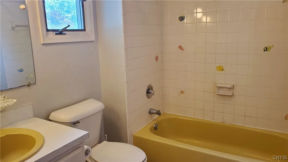    Upstairs Main Bath  with ceramic tub/shower.