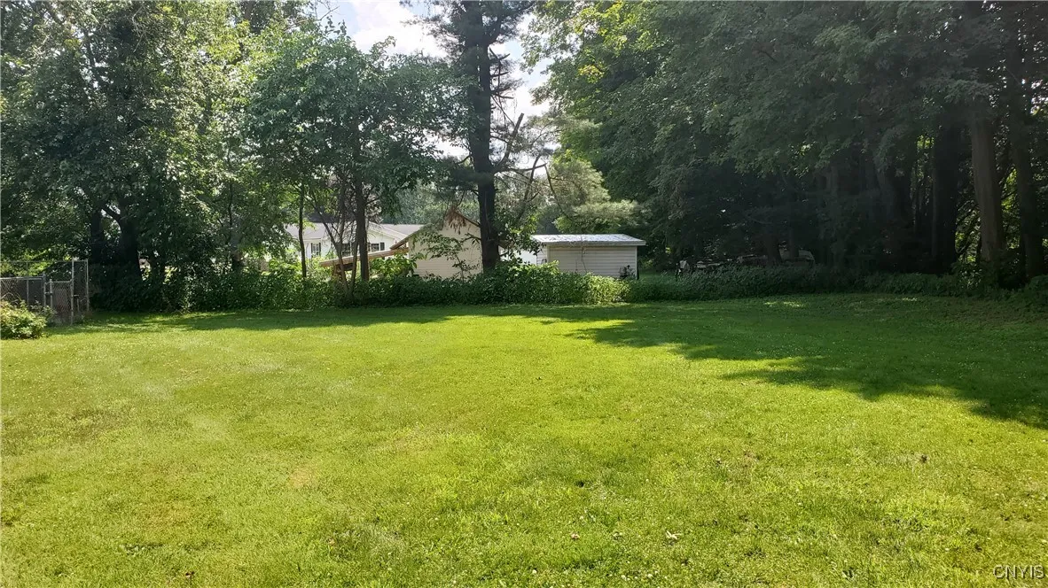    Large, private backyard with pool on the left.