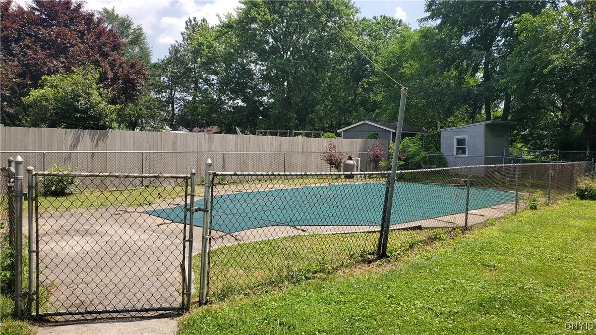 Inground pool is fully fenced in from the rest of your
  backyard.    Home sits on  .57  Acres.  Shed in background