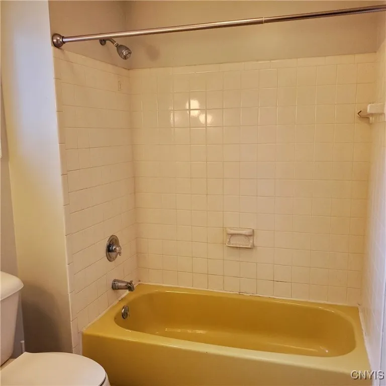    Upstairs main bath with ceramic tile.