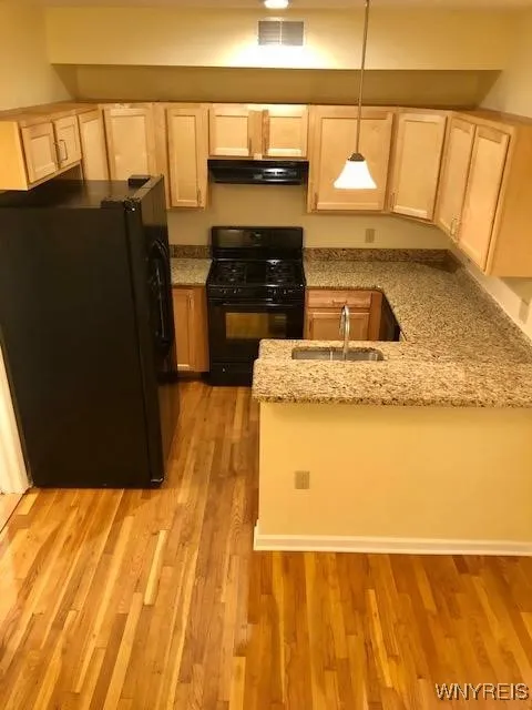 Full kitchen w/ all appliances & granite counters.