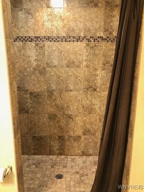 Large tiled walk in shower.