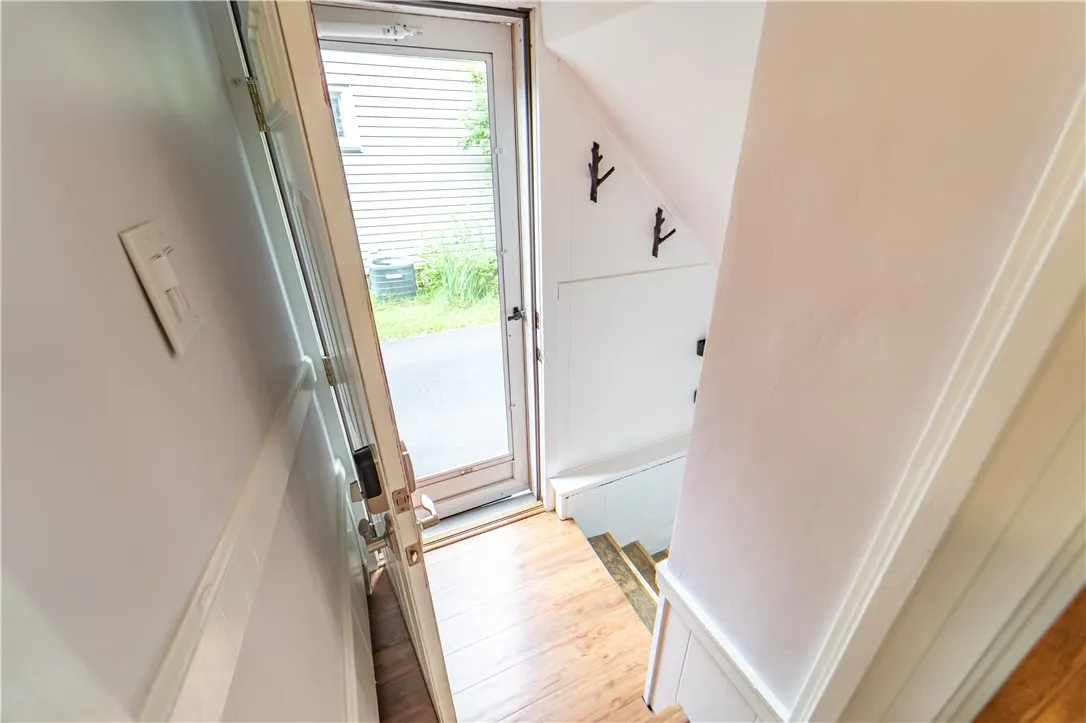 The lower level includes a second half bath, laundry area, and ample storage, rounding out the home’s exceptional functionality.