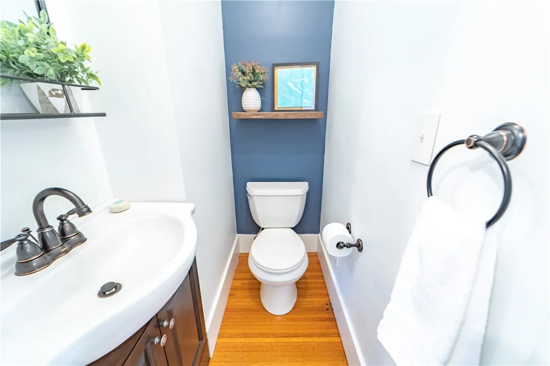 Just off the front entry, a stylish powder room adds a rare and welcome convenience.