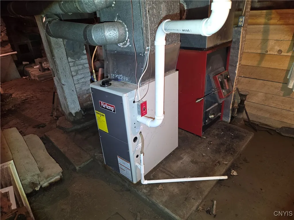 Updated propane furnace with wood add-on