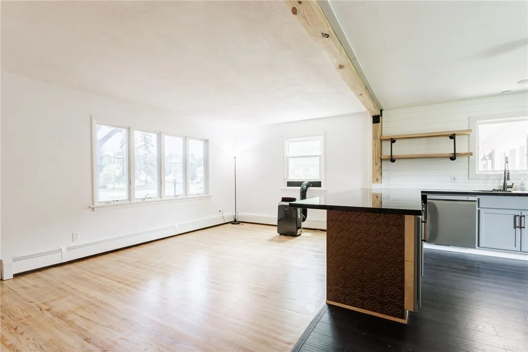 Natural wood beams bring the spaces together