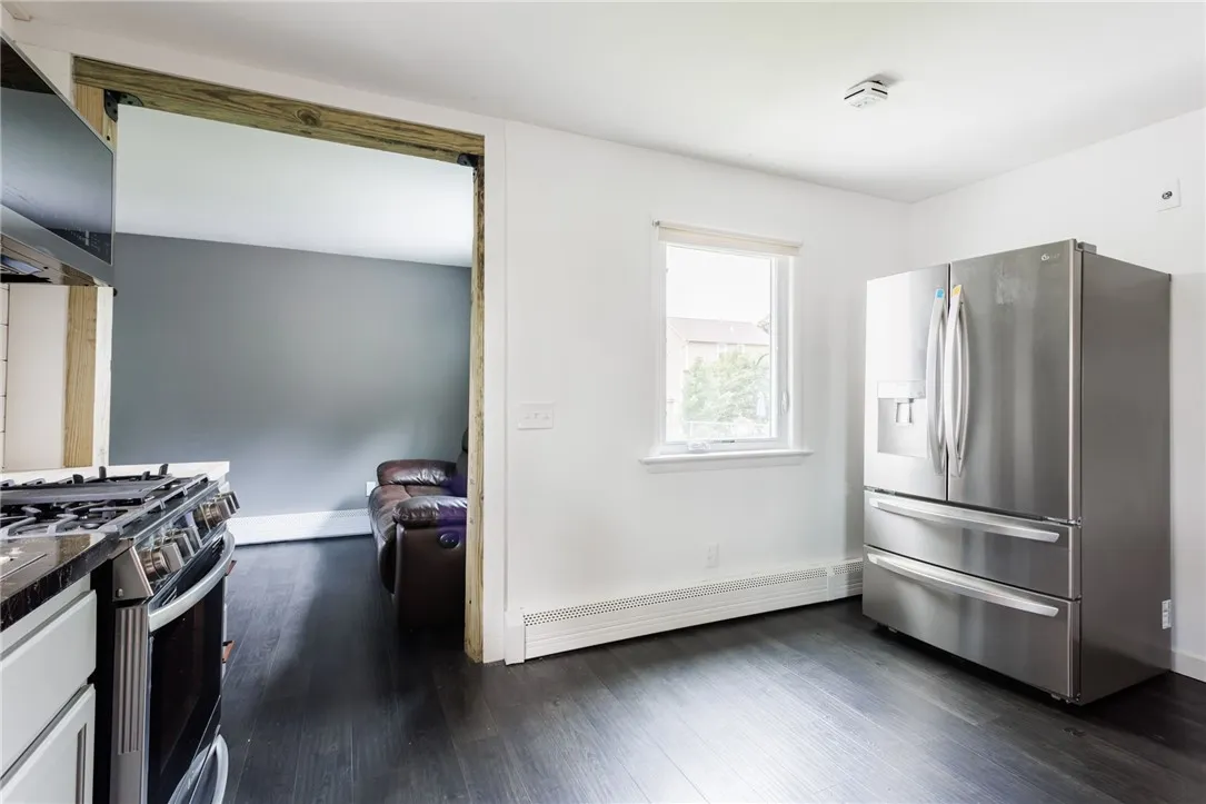 Kitchen leads to a second living space/den that has a seperate entrance from the front of the home and the garage