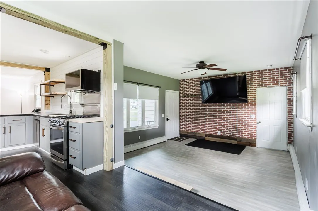 75 inch TV is included in the sale, door to the right is entrance from garage
