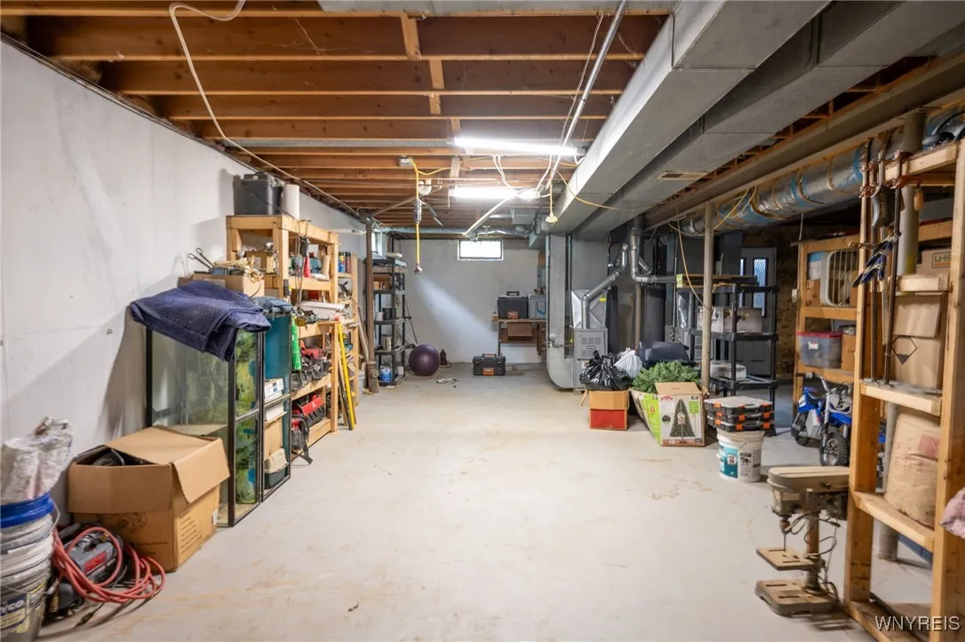 FULL BASEMENT: Wooden shelves to remain