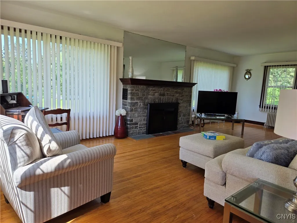 Stone fireplace with new glass door and screen. Cleaned & inspected - June 2025.