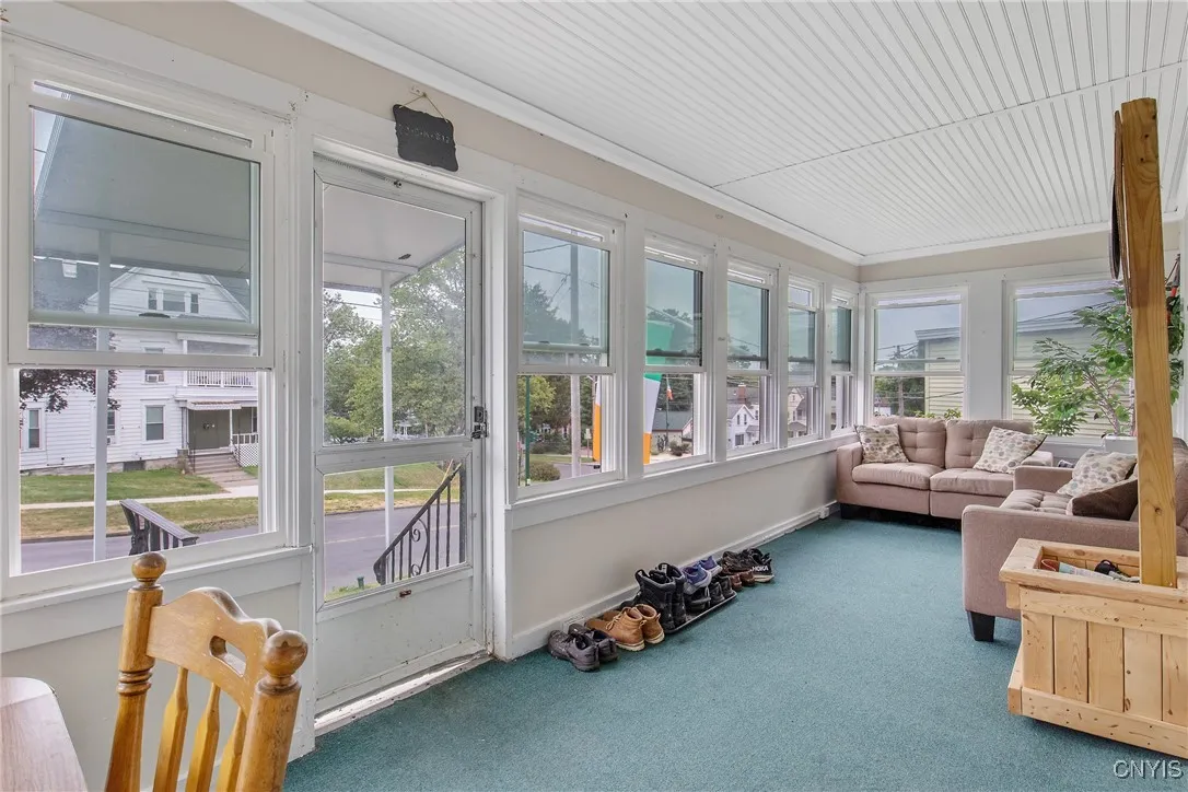 Comfortable enclosed porch overlooking the historic upside-down traffic light.