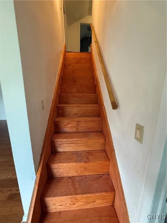 1 of 2 sets of stairs leading upstairs