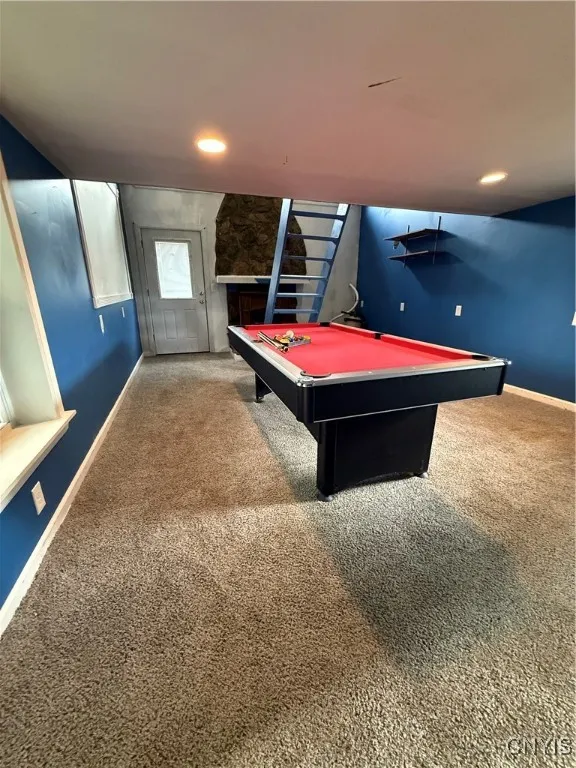 Recreation room complete with fireplace and pool table