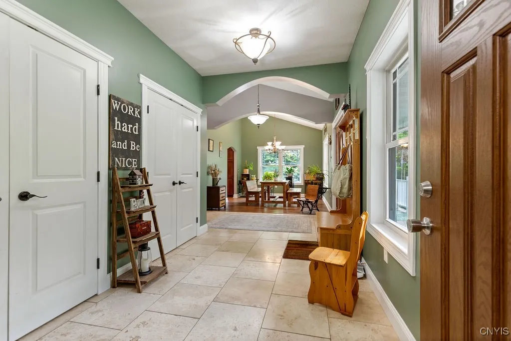 Entry/Foyer - View coming in from the oversized attached two car garage w/ storage.
