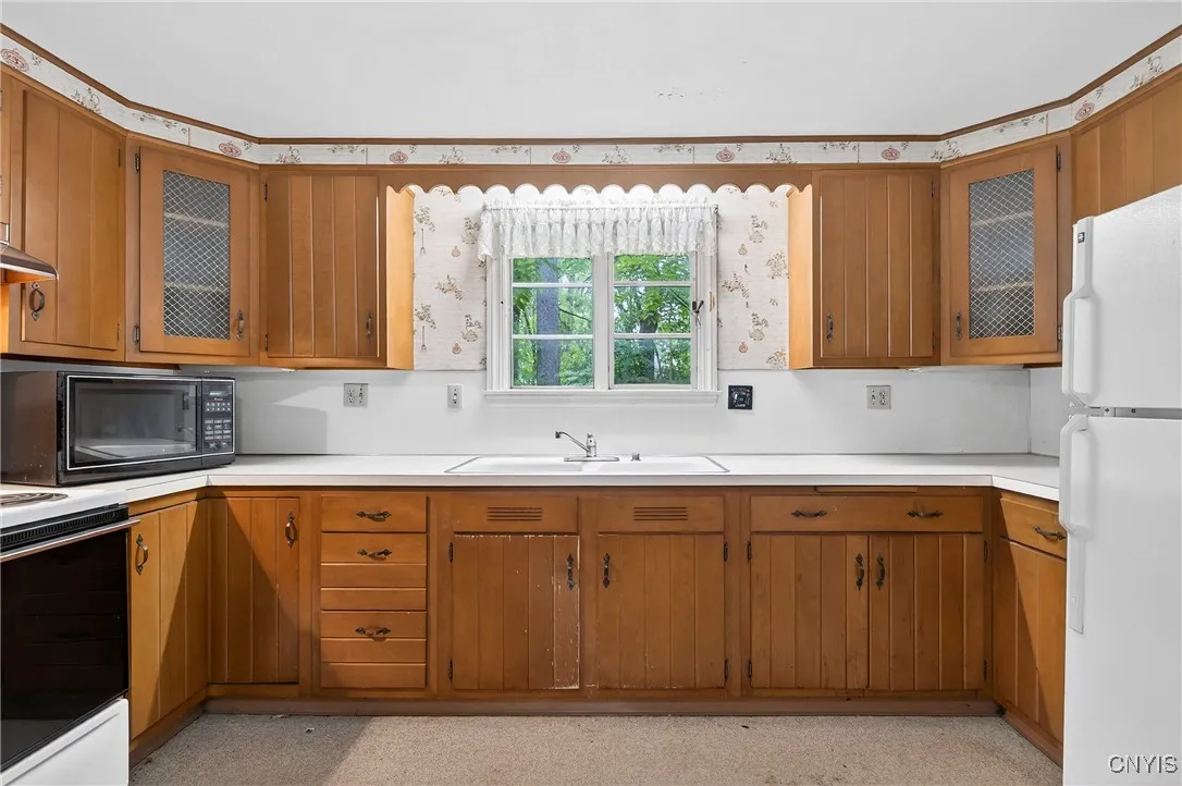Enjoy the view into the backyard while washing dishes.