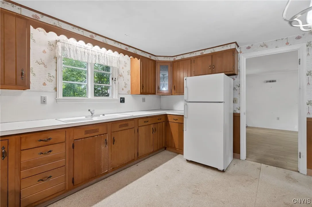 The kitchen is large enough to add a table for quick serve meals.