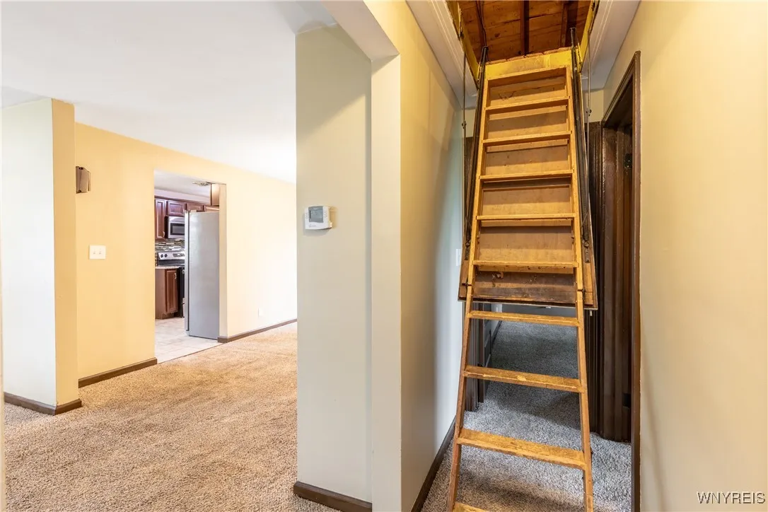 These pull-down stairs offer access to the attic for extra storage space.