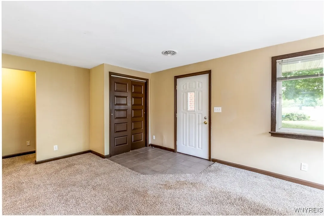Foyer and coat closet.  Bedrooms and bathroom are down the hall on the left.