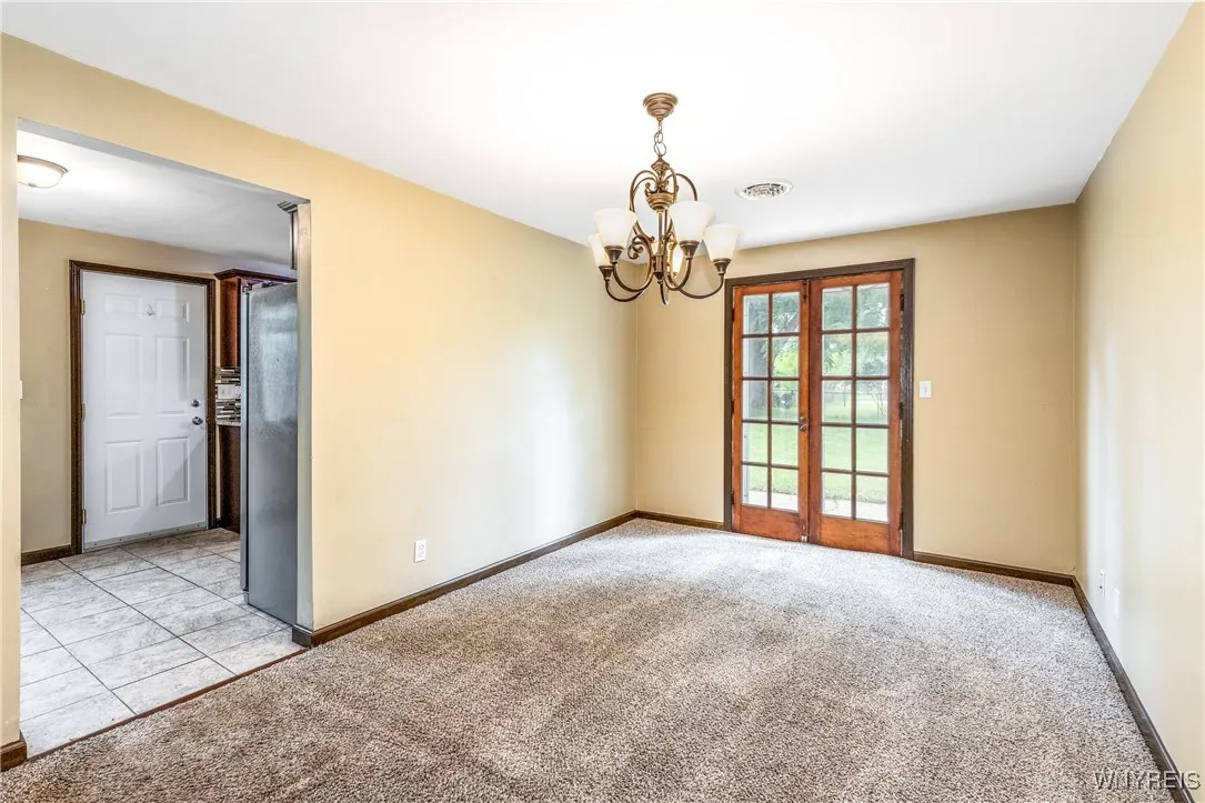 Dining room is plenty big and gives access to back patio and yard.