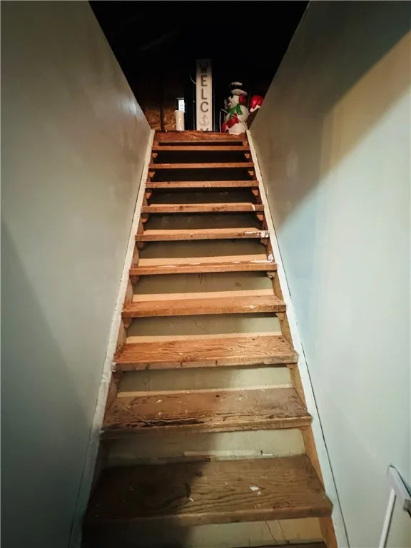 Stairs to the attic which has a ton of storage.