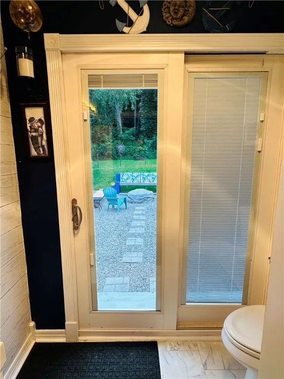 Sliding glass door to the huge, beautiful patio overlooking the tranquil back yard.