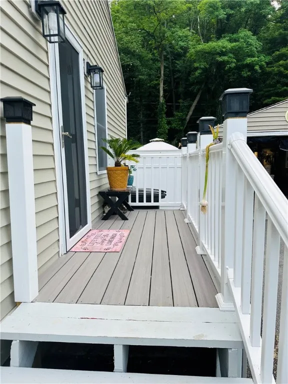 Side porch with stairs to the driveway.