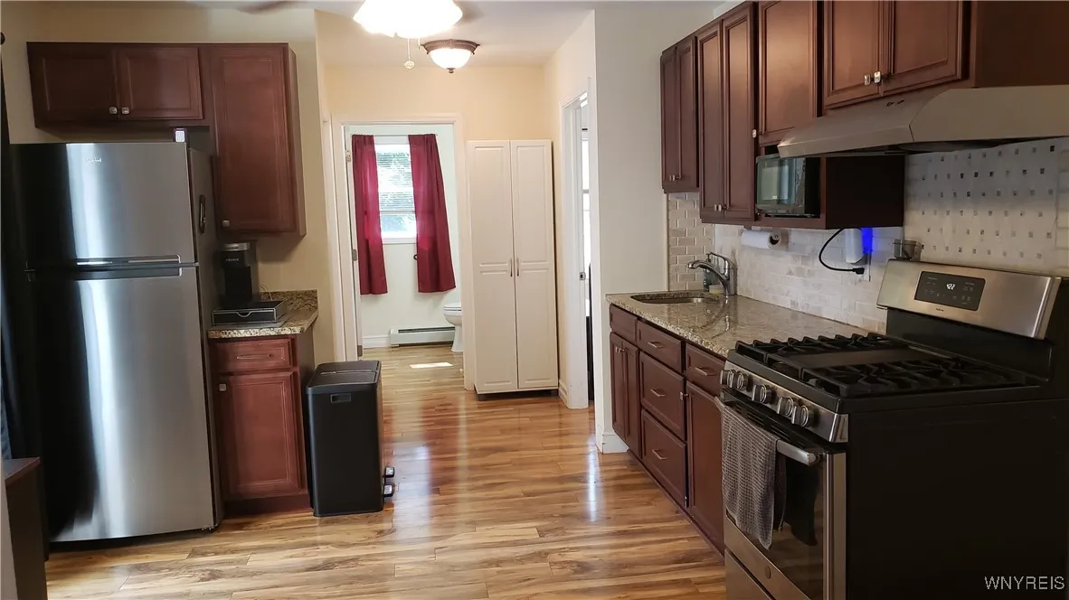 Bright open kitchen includes SS appliances