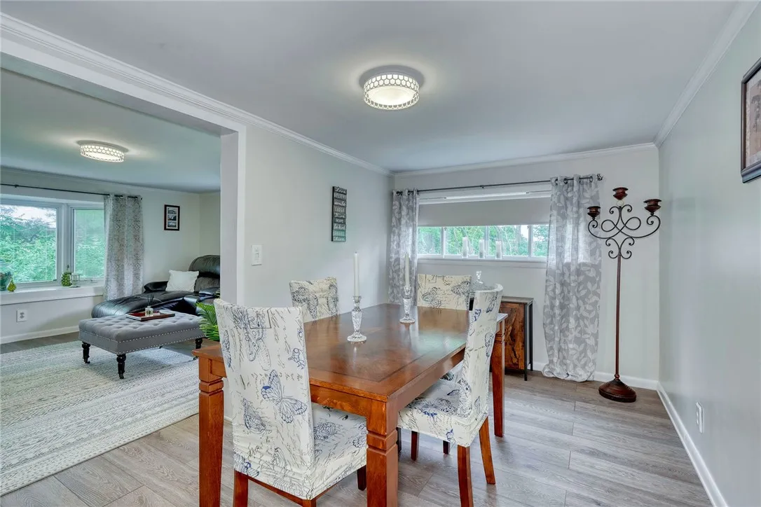 Formal dining room with luxury vinyl flooring.