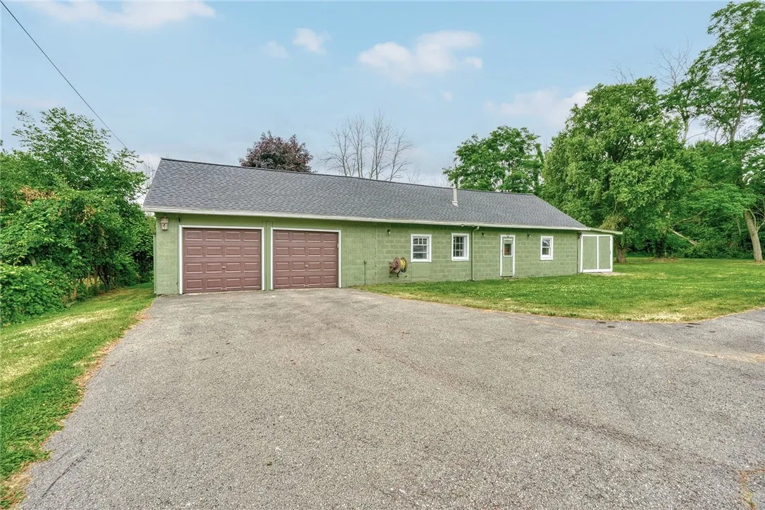 Large outbuilding with 2 bays for parking.