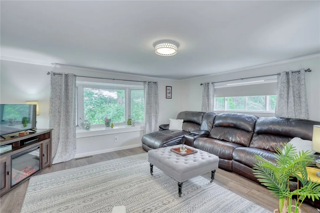 Living room on the North West corner of the home with new luxury vinyl flooring.