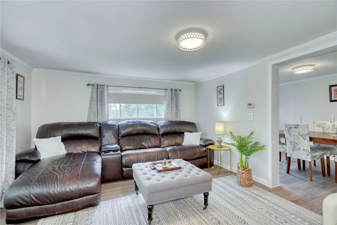 View of the living room and access to the dining room.
