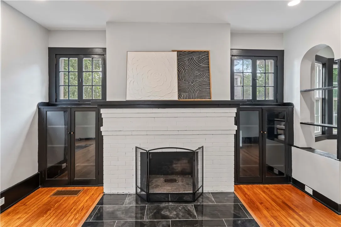 Original built in book cases on either side of fireplace