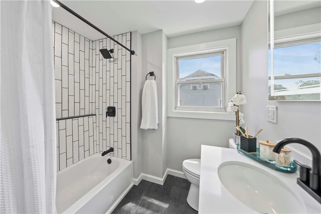 Subway tile, accent tile, ceramic tile floor, lit mirror