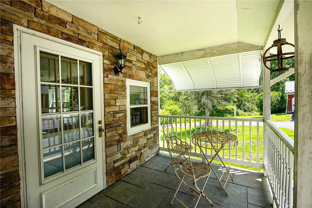 Love this covered entry porch!