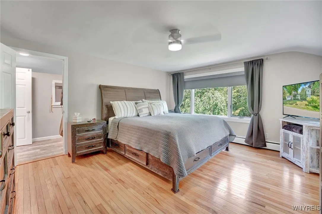 PRIMARY BEDROOM-LARGE WINDOW PROVIDES VIEWS OF WATER