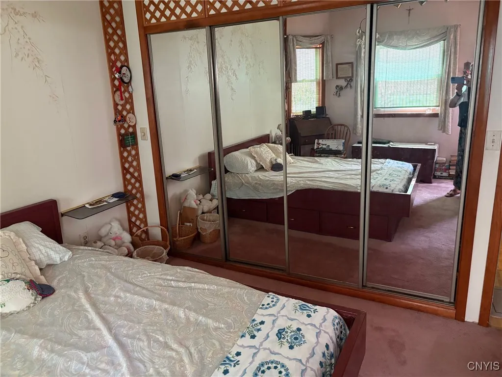 1st floor bedroom with full length mirrored closet doors