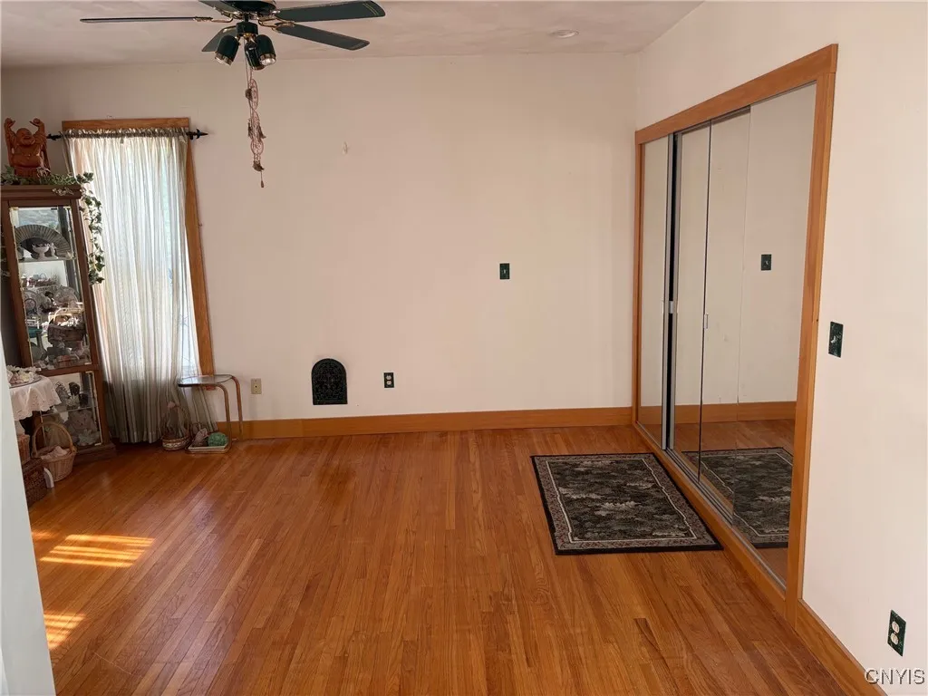 2nd floor primary bedroom/beautiful hardwood floor and full length mirrored closet doors